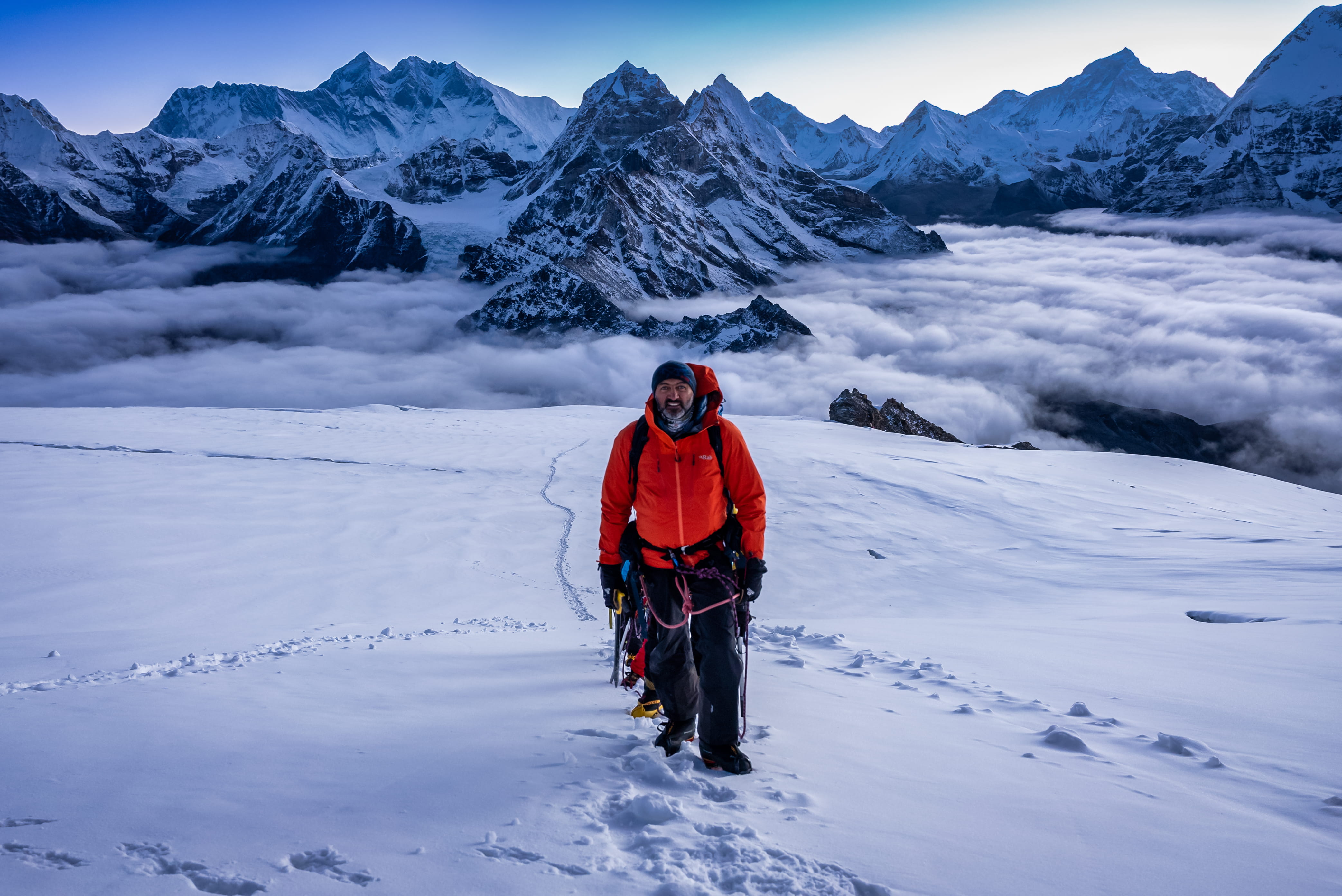 Mostafa Salameh on a snowy slope above the clouds