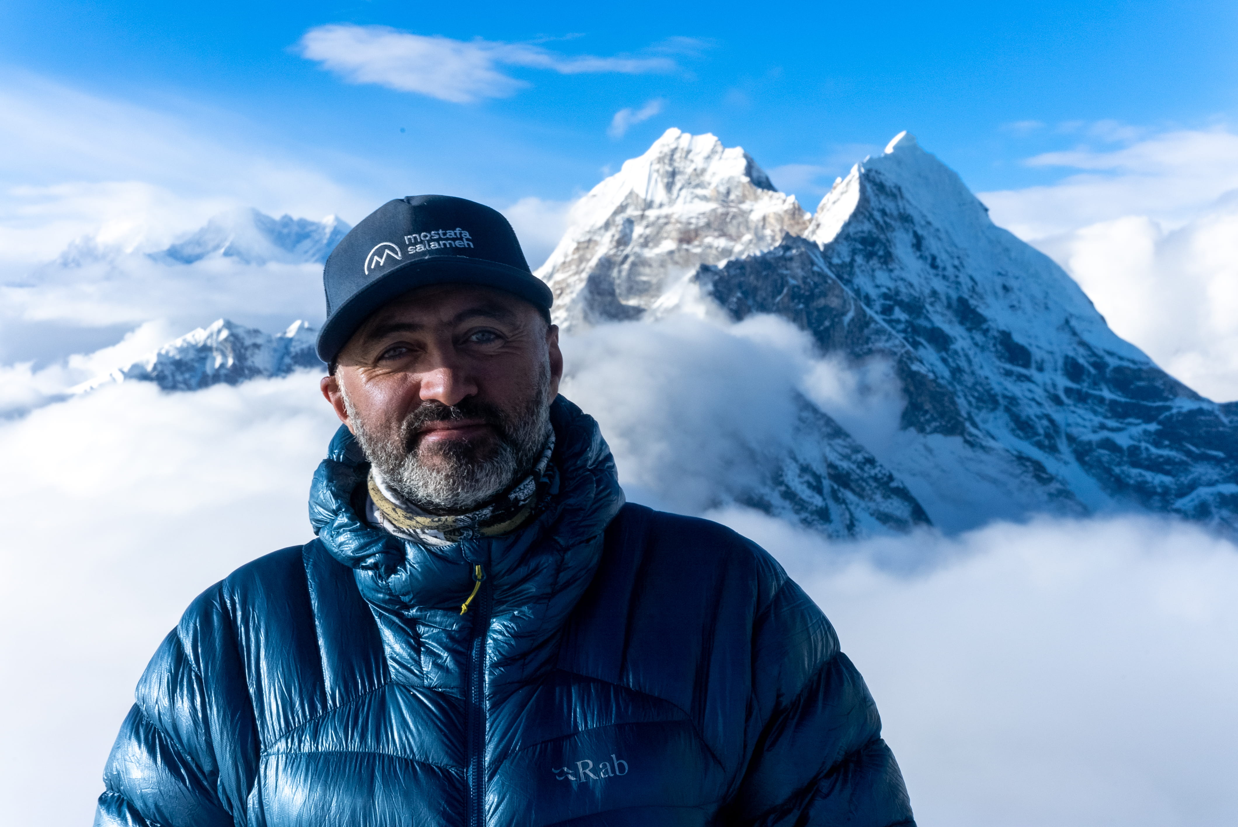 Portrait of Mostafa Salameh in front of a Himalayan peak